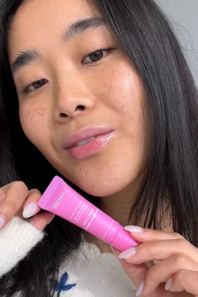 Laneige applying Lip Glowy Balm in Sweet Candy (Pink tint)